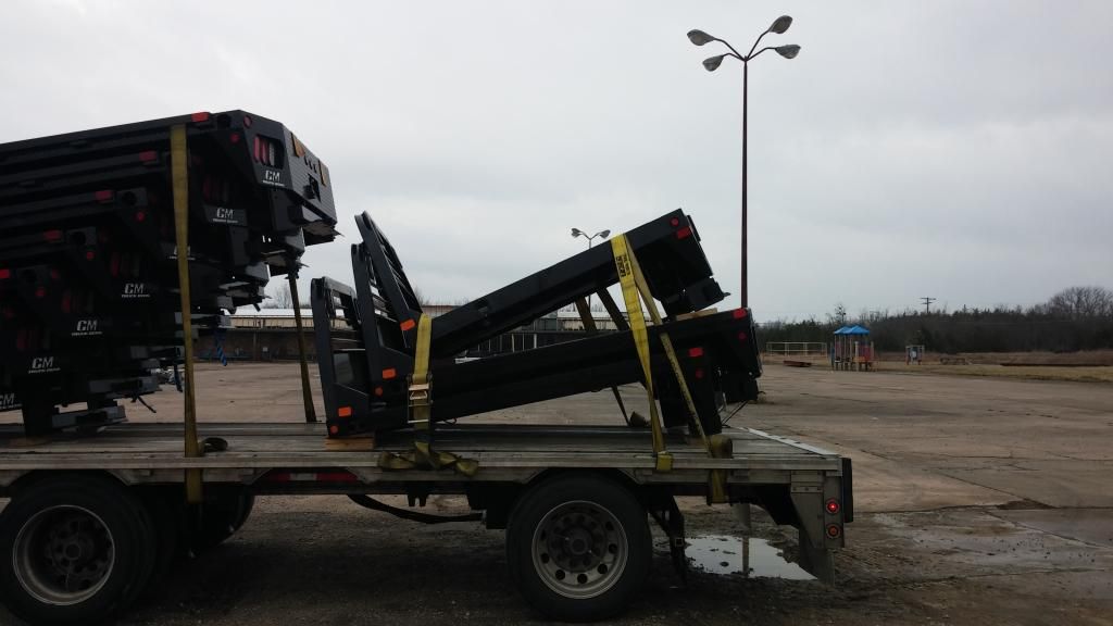 flatbed trailer loaded with steel parts