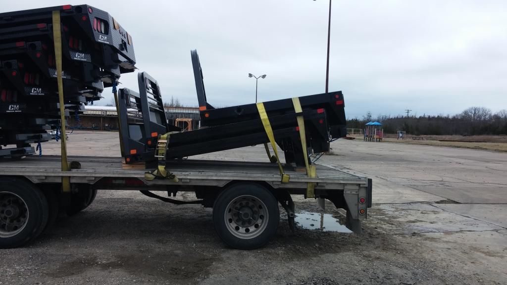 flatbed trailer loaded with steel parts